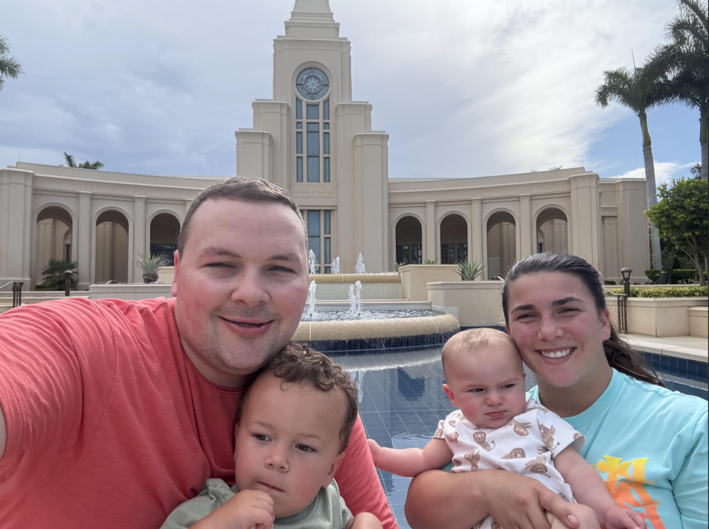 A family in front of a temple